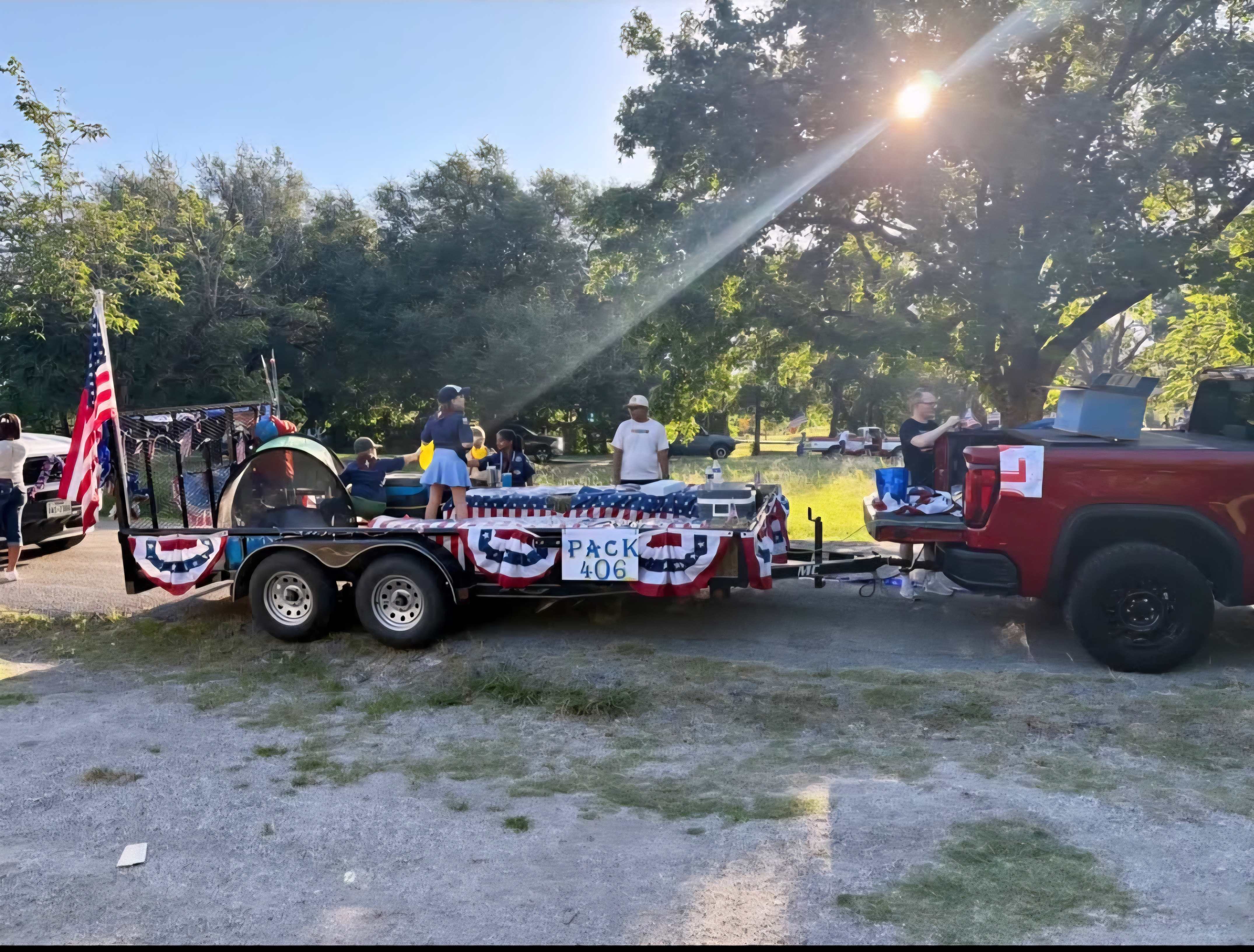 Iron Yoke LLC utility trailer decorated for July 4th parade — Pack 406 — McKinney, TX community event